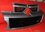 Комплект решеток (2 жабры + решетка радиатора) Stormer Range Rover Sport 2010-2012, на бензиновый двигатель. Решетка - черная, окантовка - хром, корпус - грунт под покраску.